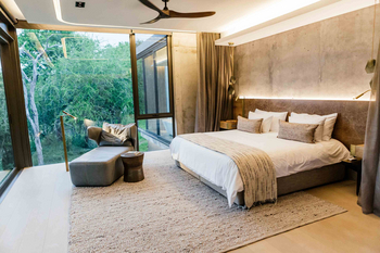 Cheetah Plains Karula House: Kingsize Bett in der Suite