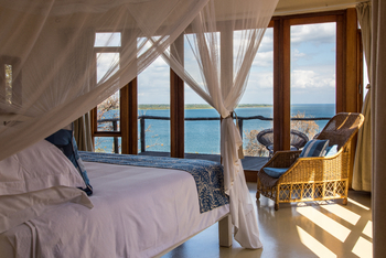 Pumulani Lodge: Doppelbett mit Moskitonetz