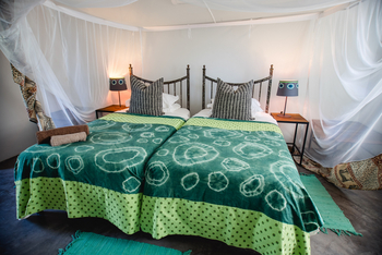 Boteti River Camp: Bett mit Moskitonetz