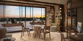 andBeyond Amazon Explorer: Bibliothek mit Baumstamm-Tisch bei Sonnenuntergang